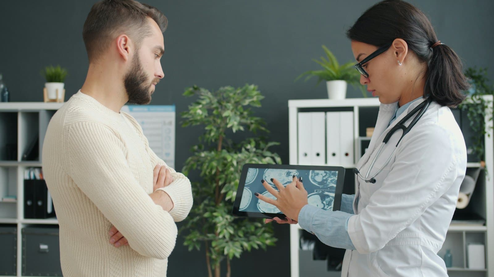 A doctor explaining a scan to a patient